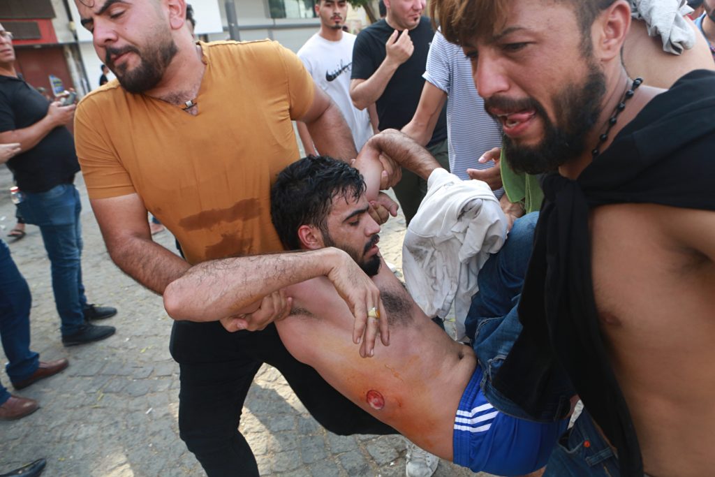 Δύο νεκροί, 200 τραυματίες σε αντικυβερνητικές διαδηλώσεις στο Ιράκ (Photos)
